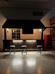 Custom bar installation with lighting and TV setup by DeJean Home Renovation in Yankton, SD.