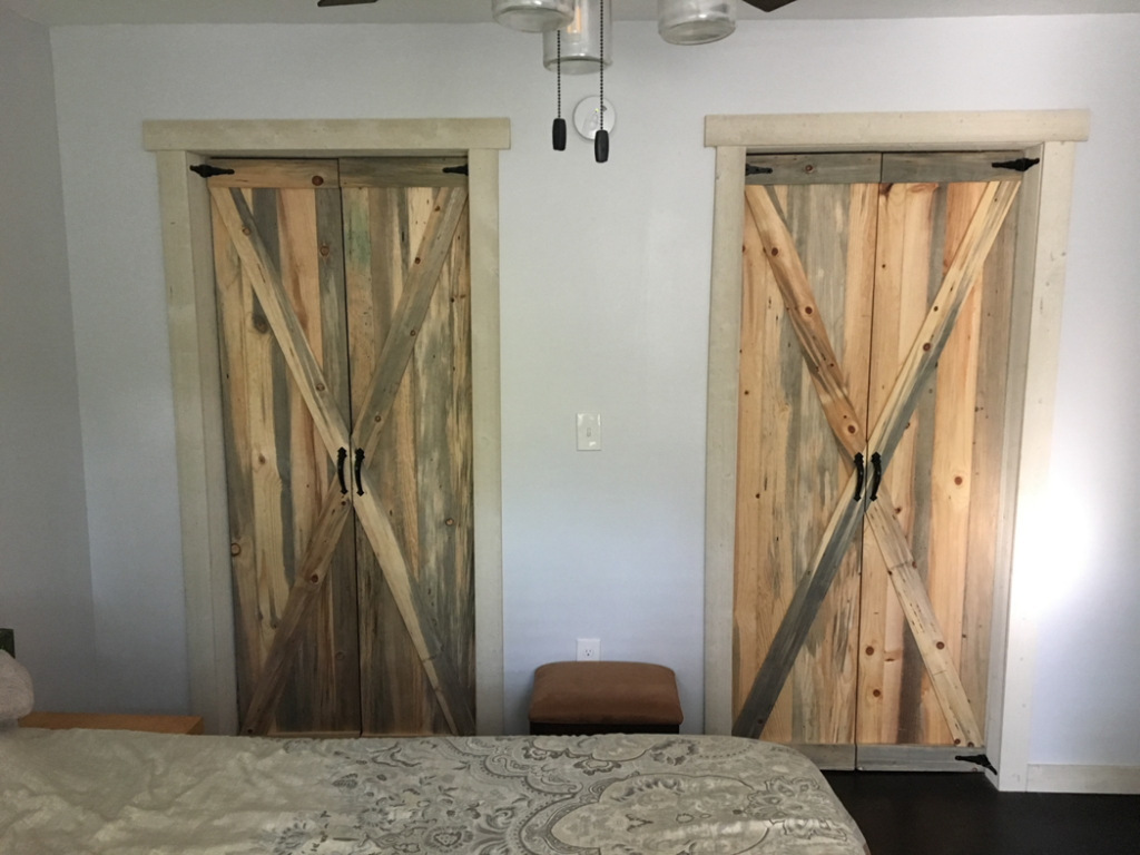 Two custom-built barn-style closet doors made from reclaimed wood by Davidson Handyman Services in Nashville, TN.