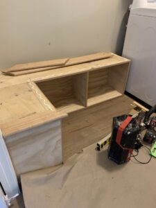 Custom built-in bench and storage unit under construction by Segovia LLC interiors in Madison, WI.