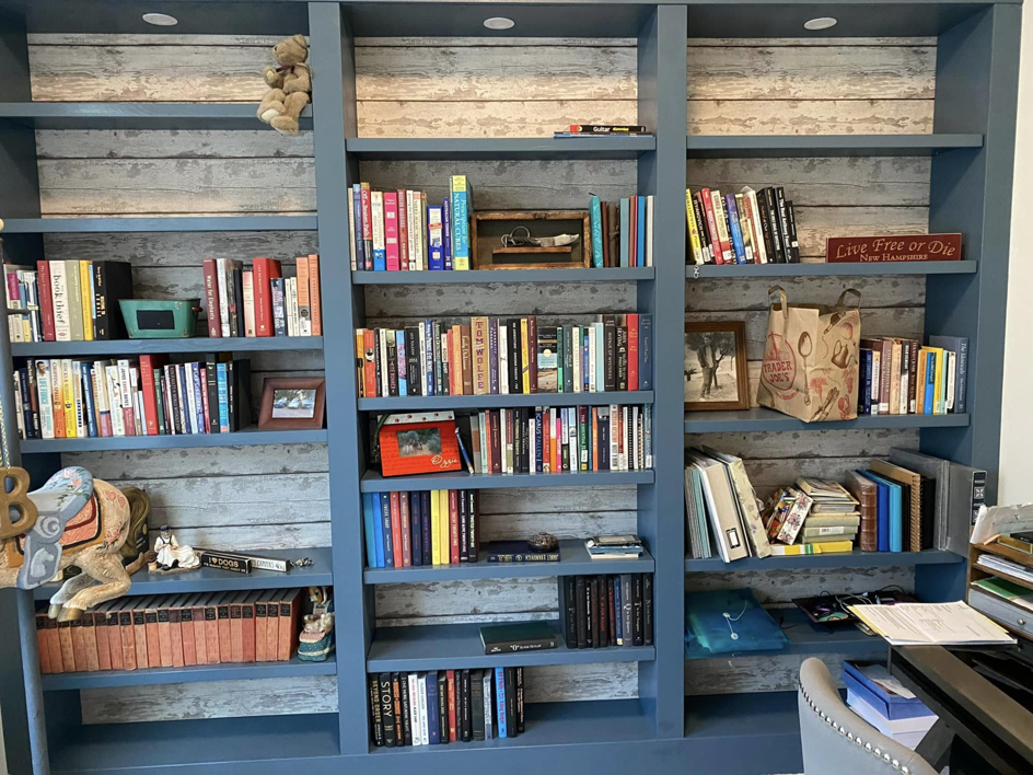 Custom built-in bookshelves with decorative shiplap backing installed by IGM Handyman Services in Meridian, ID.