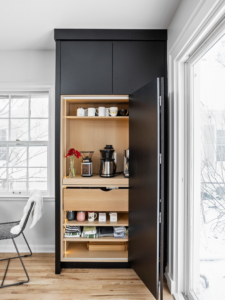 A custom-built coffee bar cabinet installed by Emergent Construction in Indianapolis, IN.