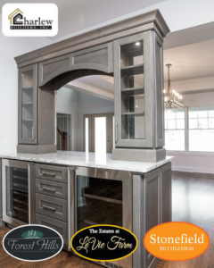 A custom built-in bar cabinet with a marble countertop and glass doors, showcasing work by Charlew Builders in Schenectady, NY.