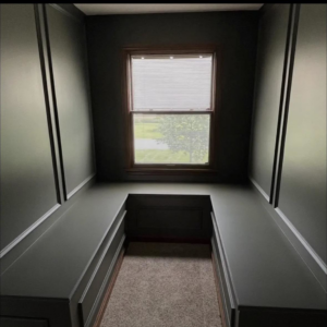Custom built-in benches and fresh dark gray paint in a room by Rock Creek Renovation and Painting in Waynesville, OH