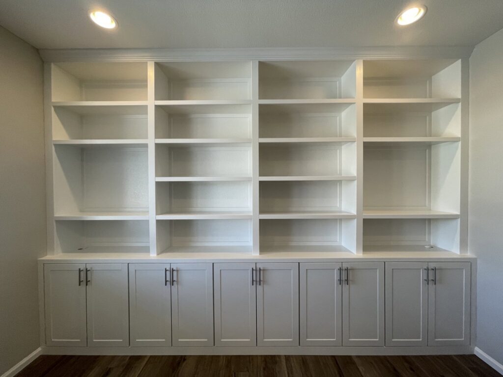 A large custom built-in bookshelf and cabinet unit installed by Colorado ProBuilt in Aurora, CO