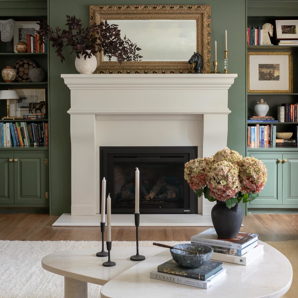Custom built-in bookshelves and a classic white mantel fireplace by Brentwood Builders Inc., a general contractor in Lancaster, PA.