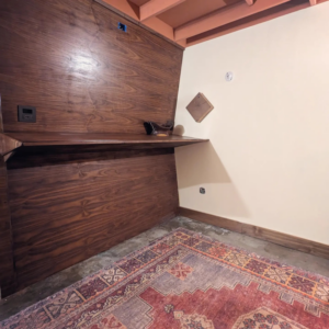 Custom built-in wooden desk with integrated electrical outlets installed by Gilbert Designs Tulsa, OK.