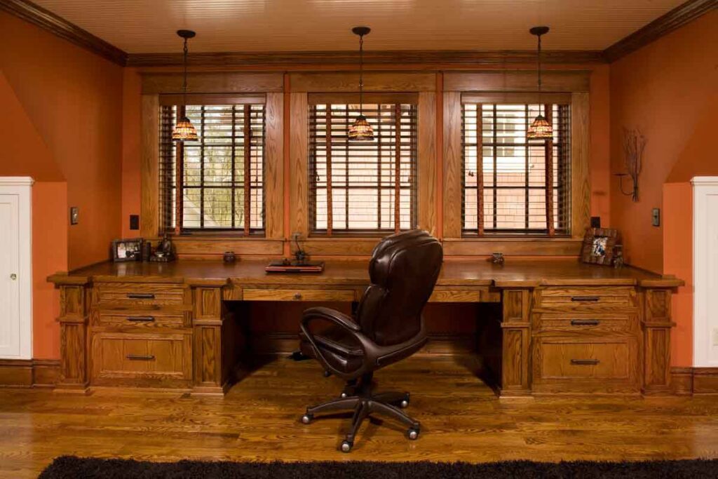 A custom built-in home office with wooden desks and cabinets, completed by Northrup Remodeling in Minneapolis, MN