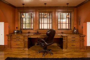A custom built-in home office with wooden desks and cabinets, completed by Northrup Remodeling in Minneapolis, MN