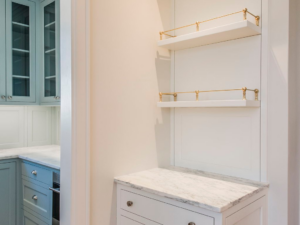 Custom built-in shelving and cabinetry with marble countertops, showcasing detailed work by Nova Constructors in Nashville, TN.