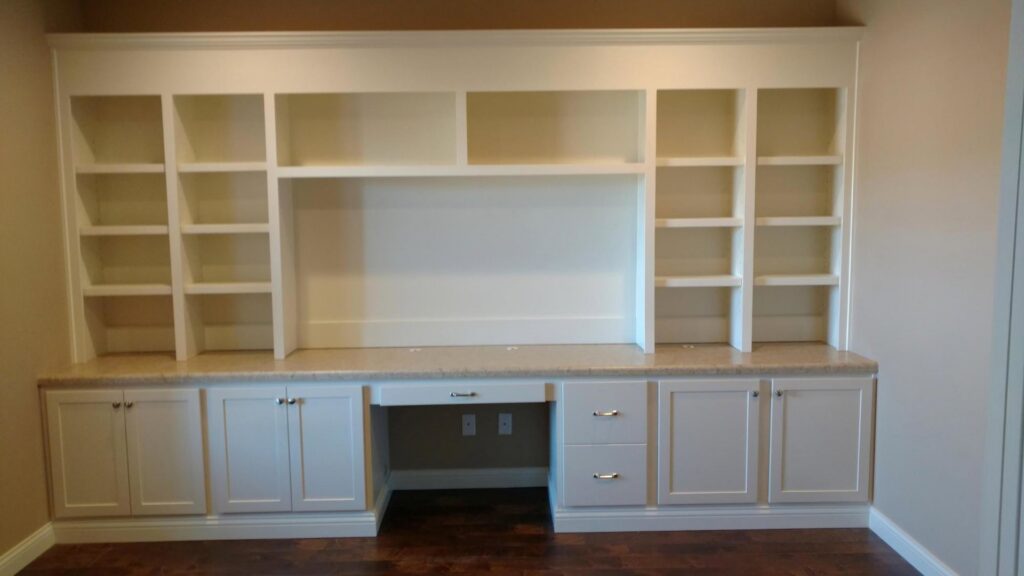 Custom built-in shelving and desk unit installed by Majestic Homes FW in Fort Wayne, IN.