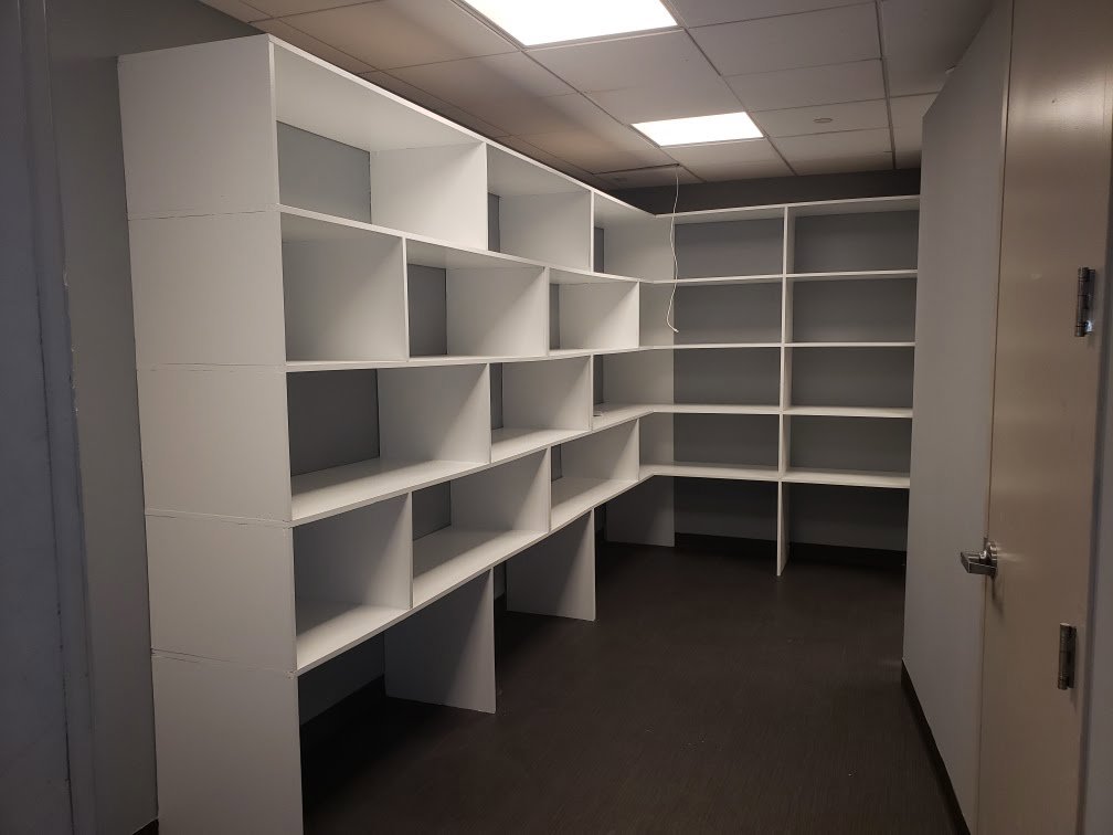 Custom built-in shelving installation in a room by Quality Services, LLC in Alexandria, VA.
