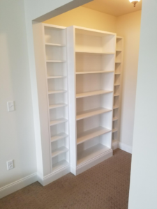 Custom built-in white bookshelves installed by Excel Home Improvement And Services in Pawling, NY