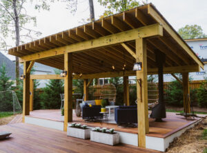 A newly constructed custom-built outdoor pergola and deck, showcasing quality craftsmanship by Boyd's Custom Building in Charlotte, NC.