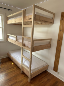 Custom-built triple bunk bed with a ladder installed by Blue Heron Property Care LLC in Kalispell, MT
