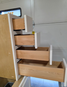 Custom cabinet drawers with visible dovetail joints, showcasing quality woodworking by Prestige Statewide, LLC in Eugene, OR.