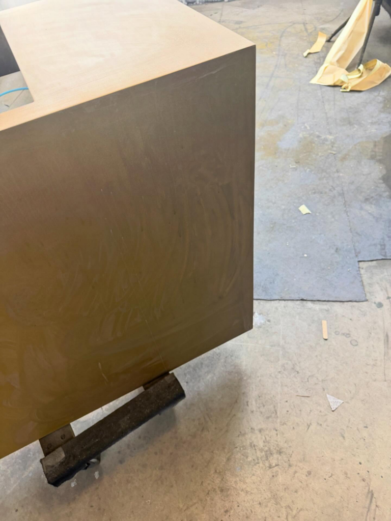 Close-up of a custom cabinet undergoing a finishing process by Bespoke Finish in Minneapolis, MN.