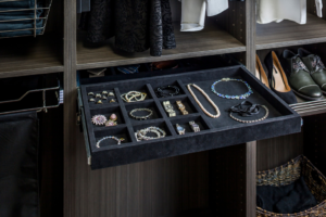 A custom closet drawer with built-in jewelry organizers installed by Preferred Millworks & Design in Edmond, OK.