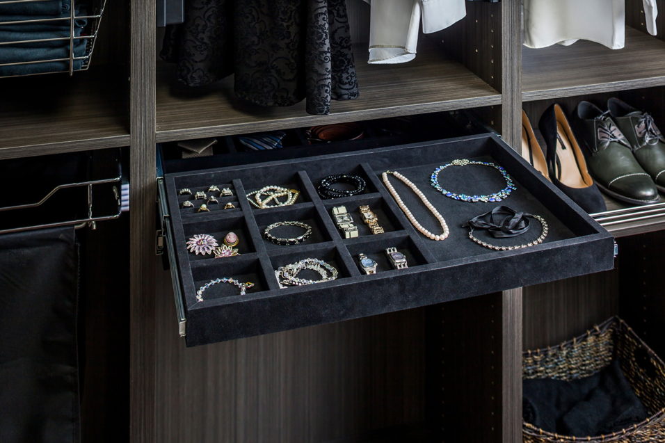 A custom closet drawer with built-in jewelry organizers installed by Preferred Millworks & Design in Edmond, OK.