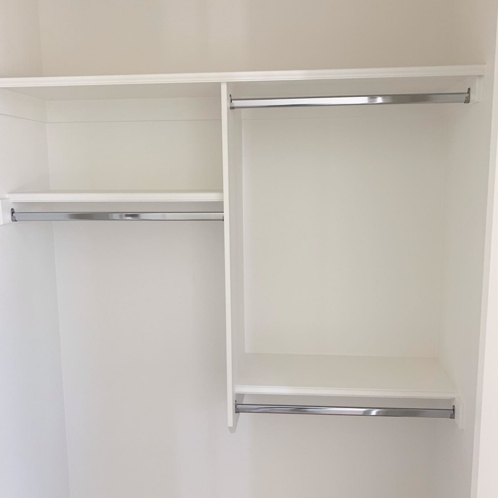 Custom closet shelves and hanging rods installation by Mountain Door and Trim in Phoenix, AZ.