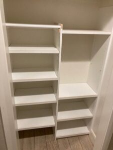 Custom white shelving units installed in an empty closet by Rod's Handyman Services, LLC in Boise, ID.