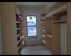 A custom wooden closet shelving system installed by Blue Ridge Customs LLC in a Raleigh, NC residence.