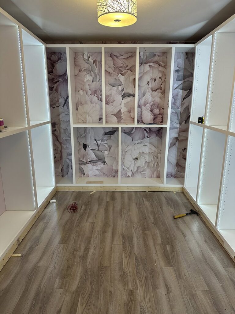 Custom closet shelving with decorative wallpaper accent wall installed by CWS Handyman LLC in Seekonk, MA