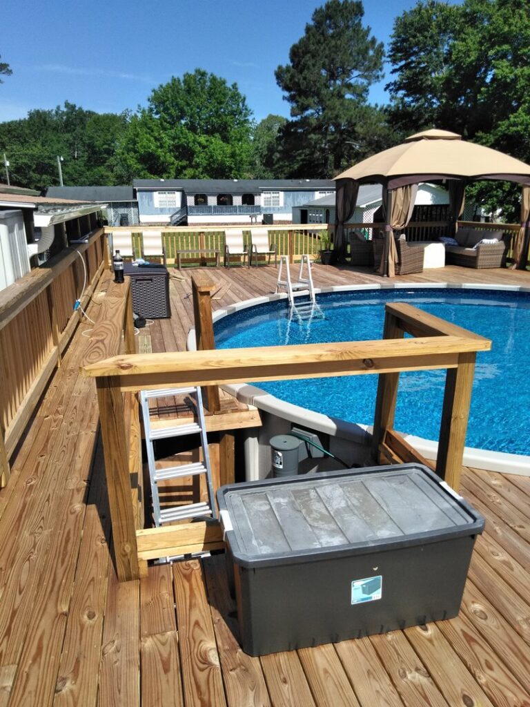 A custom-built wooden deck and pool area by Holy City Remodel in North Charleston, SC.