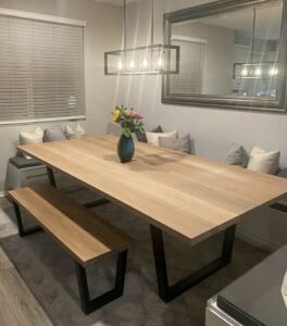 A custom wooden dining table and matching bench built by Renegade Woodworks in Kearney, NE.