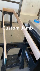 A custom door jamb being fabricated on sawhorses, showcasing carpentry work by T&K Services in Idaho Falls, ID