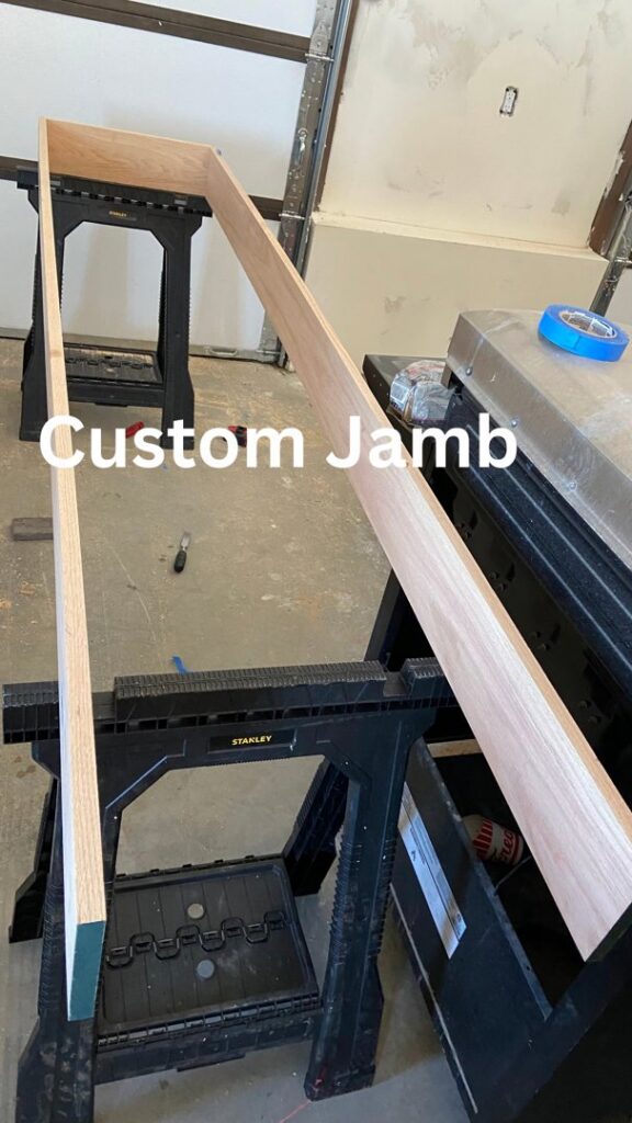 A custom door jamb being fabricated on sawhorses, showcasing carpentry work by T&K Services in Idaho Falls, ID