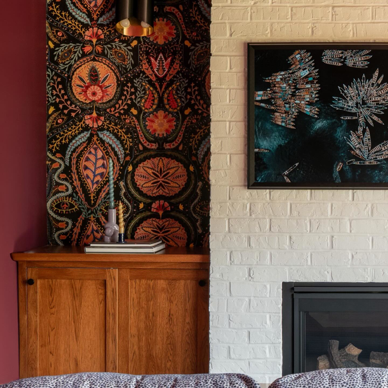 Custom white brick fireplace and built-in cabinet installation by Brentwood Builders Inc., a general contractor in Lancaster, PA.