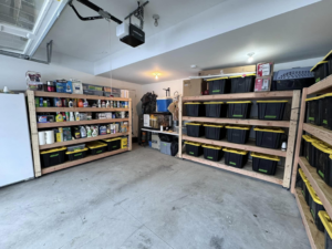 Newly installed custom wooden shelves in a garage by Home Pros WV in Charleston, WV.