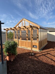 Custom greenhouse construction with attached pergola by Panhandle Contracting Co. in Rathdrum, ID