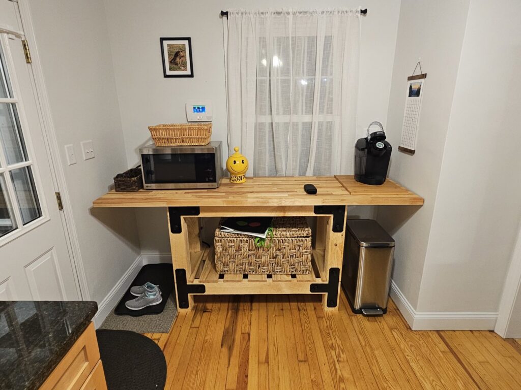 A custom-built wooden kitchen countertop with integrated storage by Garbatini Contracting in Wallingford, CT.