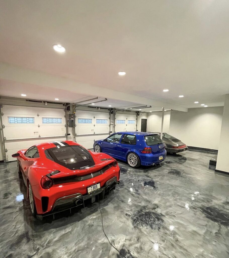 A custom luxury garage build with a decorative epoxy floor by Roche Epoxy Floors in Allentown, PA.