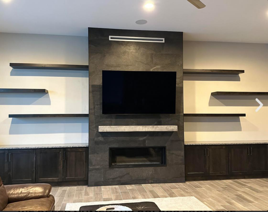 Custom media wall with fireplace, built-in cabinets, and floating shelves by Arizona Cabinet & Countertop Company in Tucson, AZ.