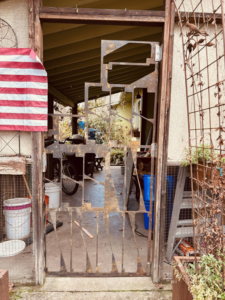A custom metal gate with unique cutouts installed by Get it-Got It-Gone, LLC. in Goodview, VA.
