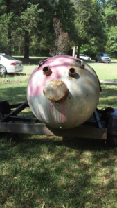 A custom fabricated spherical metal tank on a trailer, resembling a face, by Charlotte's Welding Service in Rock Hill, SC