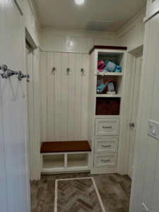 Custom mudroom bench and shelving unit with coat hooks by Lardieri's Custom Woodworking Company, Inc. in Lakewood, NJ.