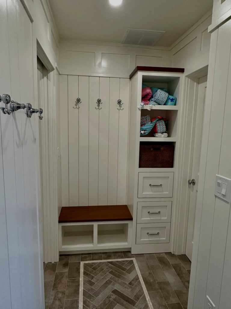 Custom mudroom bench and shelving unit with coat hooks by Lardieri's Custom Woodworking Company, Inc. in Lakewood, NJ.