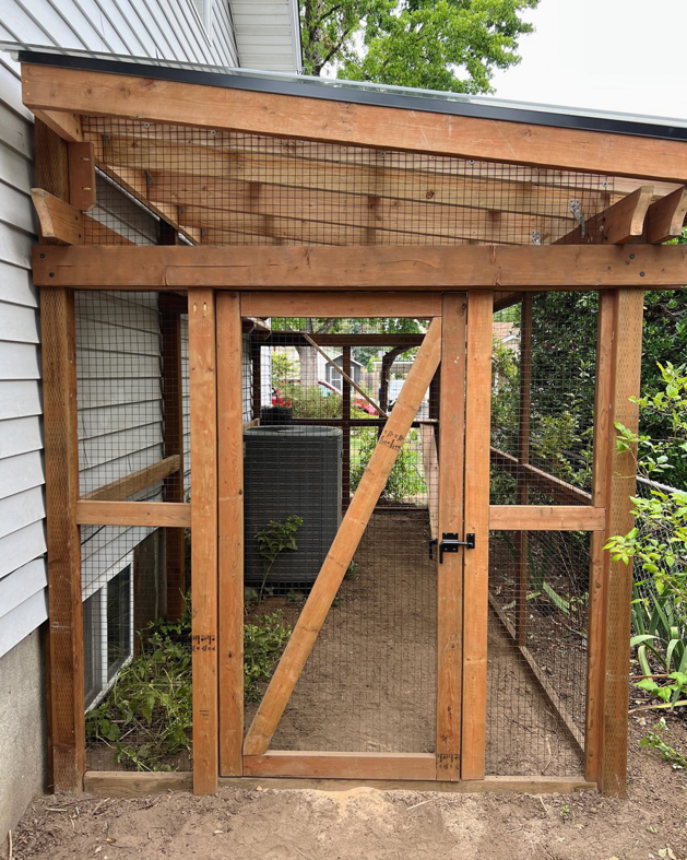 Custom outdoor pet enclosure construction with wood framing and wire mesh by Balance Painting & Remodeling, LLC in Portland, OR.