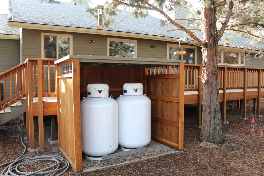 A custom-built wooden enclosure for propane tanks constructed by MW Construction Services in Bend, OR.