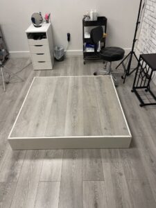 Custom-built raised platform with flooring installed by Jonny Handyman Services in Roy, UT.