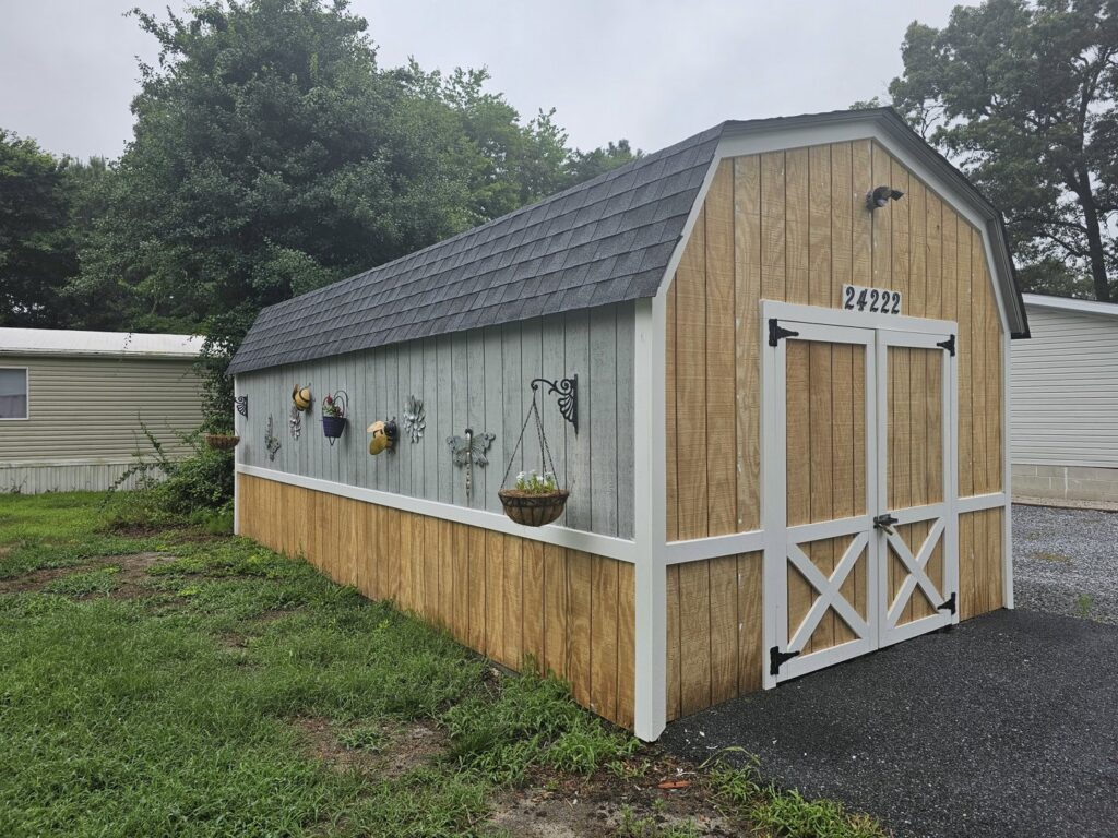Custom built shed with new siding and barn doors by A Man Who Can LLC, your handyman in Milford, DE.