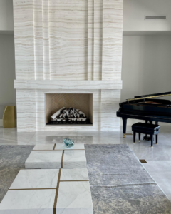 A beautifully installed custom stone fireplace with a modern design, completed by Dorado Stone Inc. in Tucson, AZ.