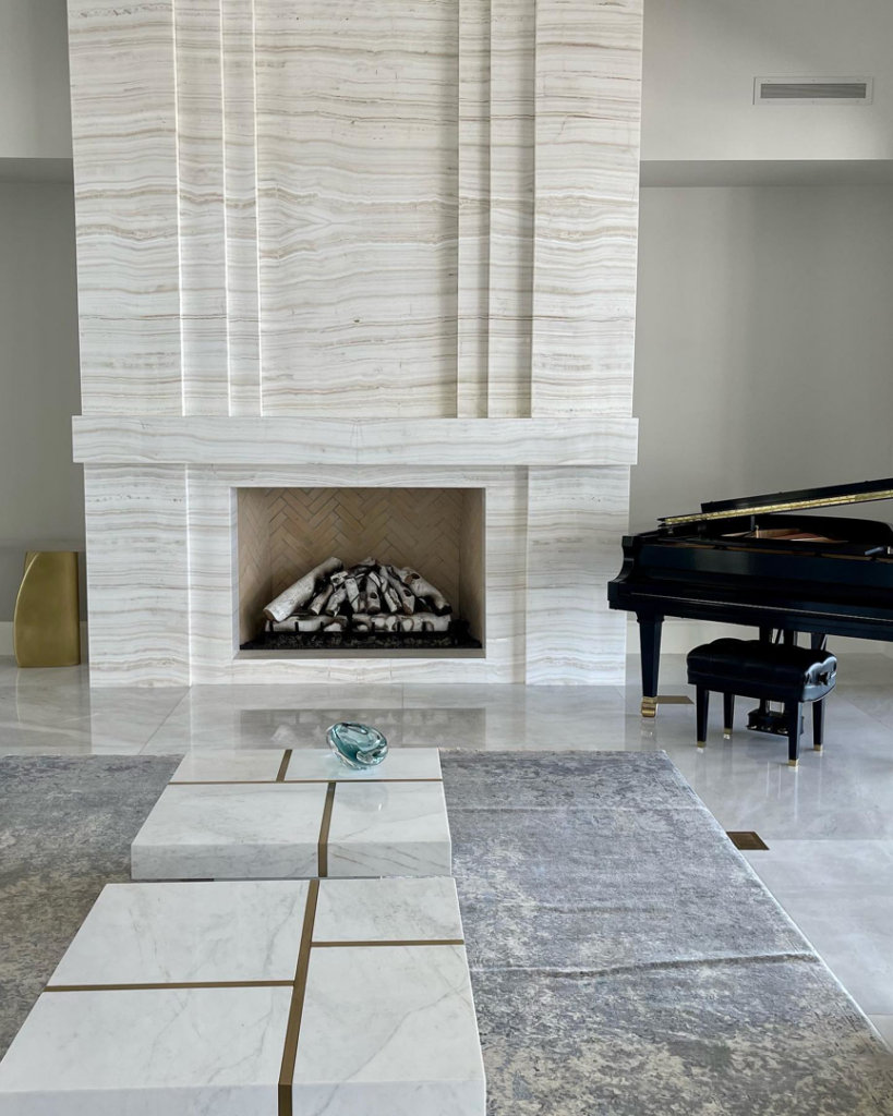A beautifully installed custom stone fireplace with a modern design, completed by Dorado Stone Inc. in Tucson, AZ.