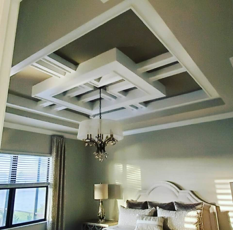 A beautifully designed custom tray ceiling in a bedroom by Catalyst Contracting in Cape Coral, FL.