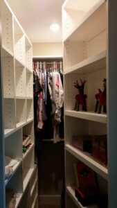 A custom-designed walk-in closet with new shelving installed by Constructed by 360 LLC in Meridian, ID.
