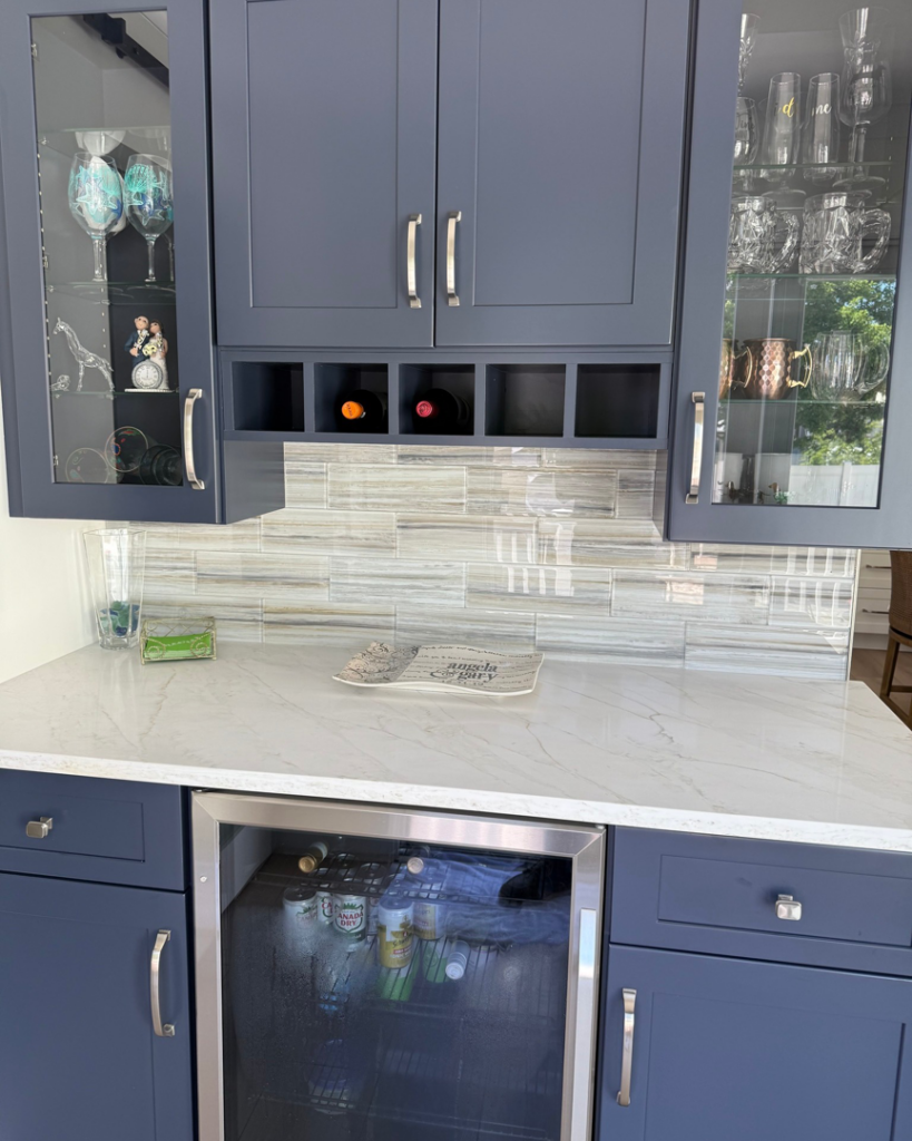 A newly installed custom wet bar with blue cabinets and a tile backsplash by JRG General Home Services, LLC in Toms River, NJ.