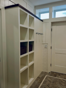 Custom white cubby shelving unit installed in an entryway by Lardieri's Custom Woodworking Company, Inc. in Lakewood, NJ.